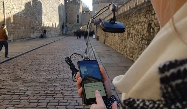 Historic Royal Palaces app being used outside