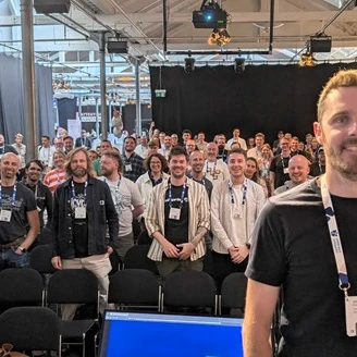 James Hobbs at Codegarden with people attending the Umbraco hosted event