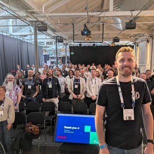 James Hobbs at Codegarden with people attending the Umbraco hosted event