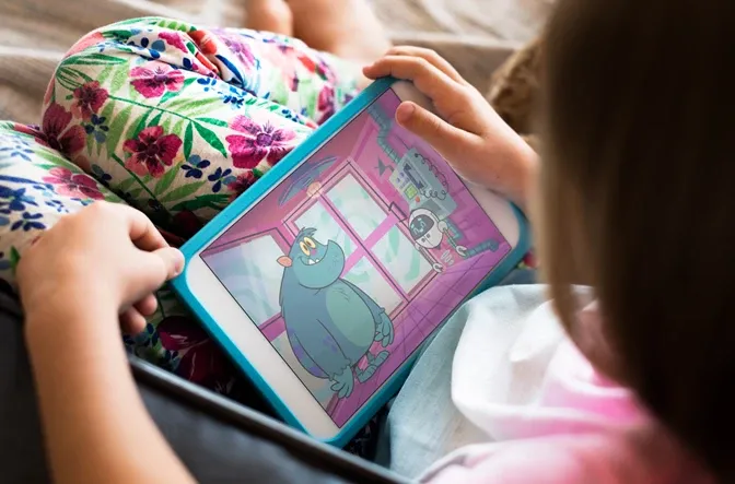 Child on their tablet playing a BBC game