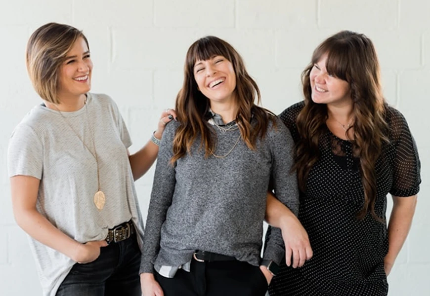 3 women laughing together