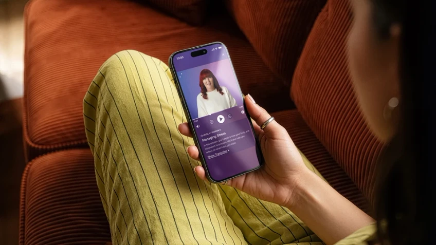 Lumino app being used by lady on a sofa