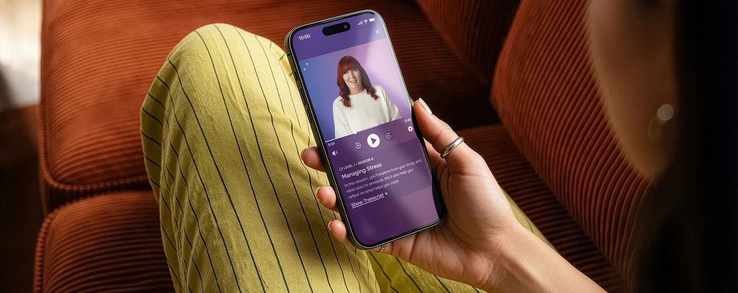Lumino app being used by lady on a sofa