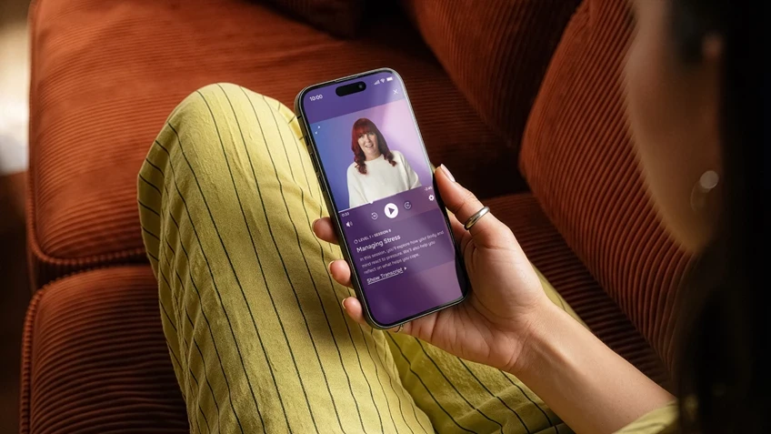 Lumino app being used by lady on a sofa