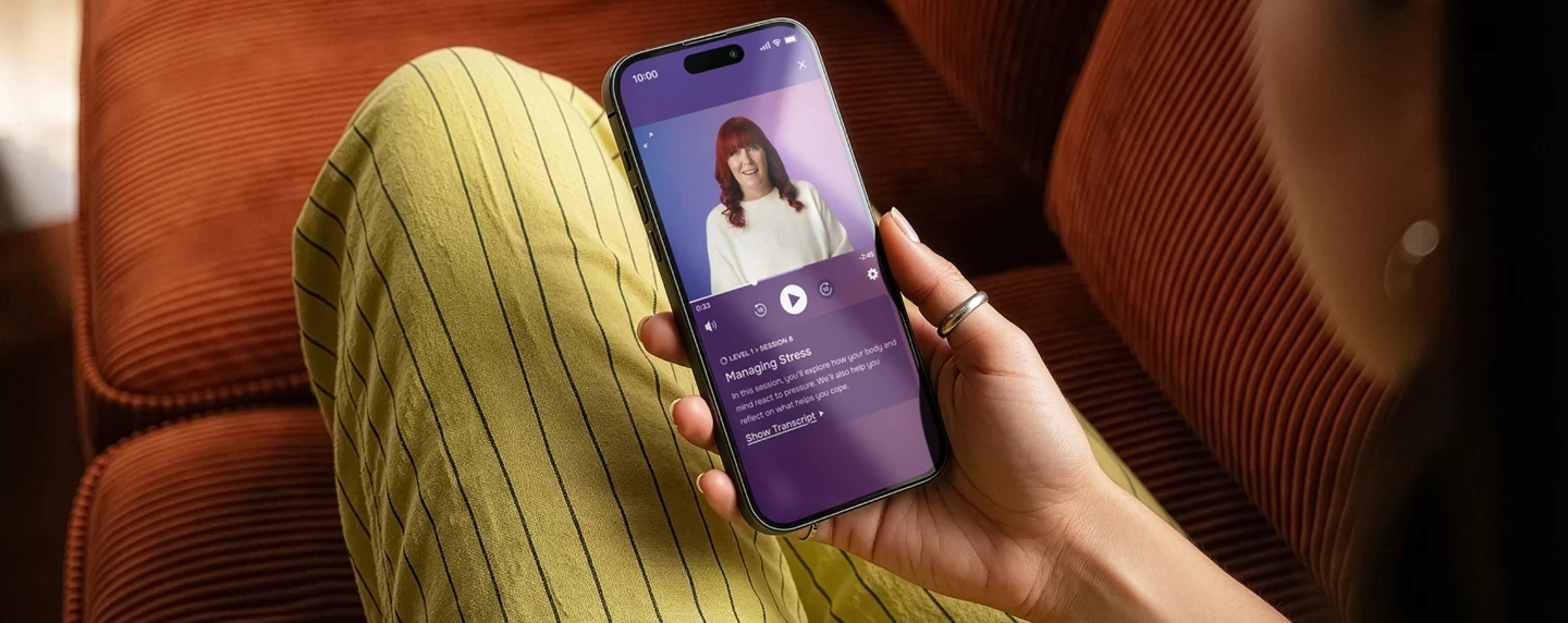 Lumino app being used by lady on a sofa