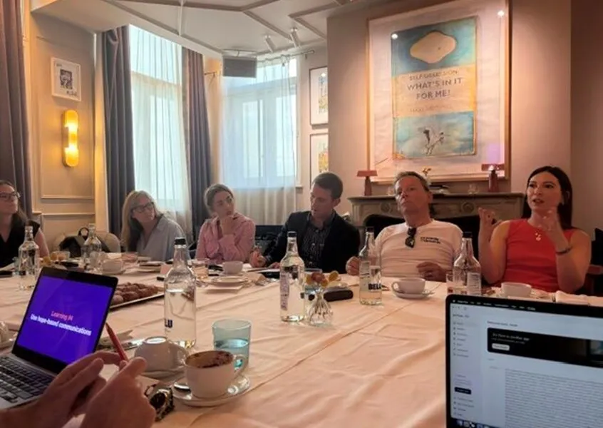 People discussing the topic around a table