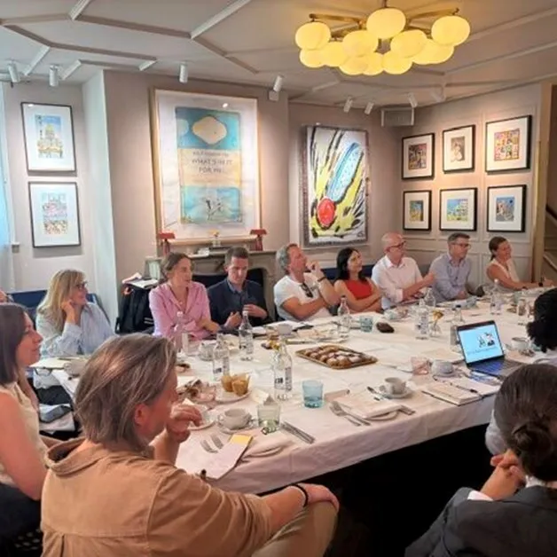 Guests around a table at the lunch and learn event