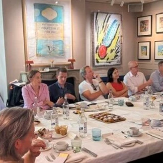 Guests around a table at the lunch and learn event